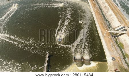 Shrimp Farm, Prawn Farming With With Aerator Pump Oxygenation Water Near Ocean. Aerial View Fish Far