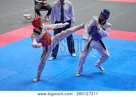 ST. PETERSBURG, RUSSIA - OCTOBER 17, 2015: Unidentified athletes compete in the individual taekwondo tournament during the martial arts festival Baltic Sea Cup in Sibur Arena