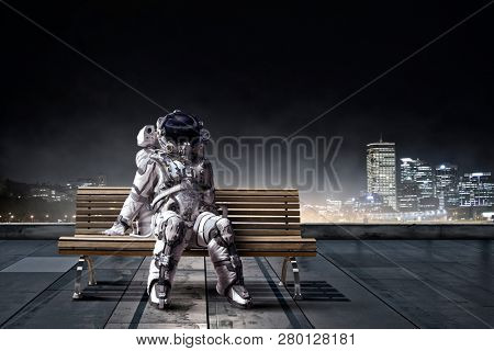 Rocketman on bench. Mixed media