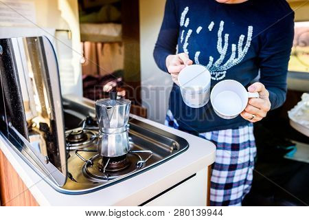 Cooking Coffee In Campervan, Caravan Or Rv On Camping Trip.