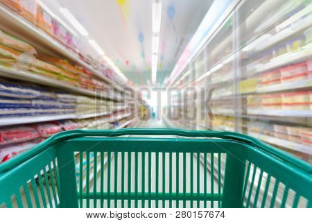 Closeup Shopping Basket Green Color With Blurred Suppermarket Background