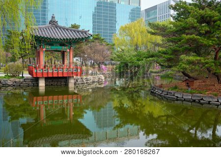 Yeouido Park public park pond with pavilion summerhouse in Seoul, Korea