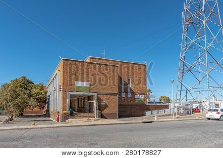 De Aar, South Africa, August 6, 2018: A Street Scene, With The Railroad Station, In De Aar In The No