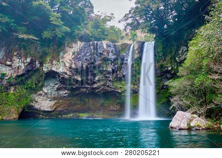 Cheonjiyeon waterfall falls one of tourist attractions of Jeju Island, South Korea