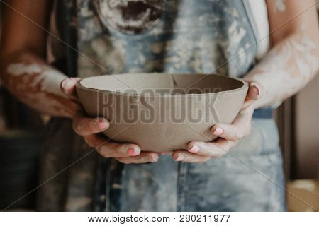 Pottery, Clay, Ceramics Art Concept - Closeup On Hands Of Young Master With The Large Plate From Fir