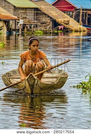 Girl Rowing Her Boat On Tonle Sap Lake, Cambodia During Flood On Oct 14, 2011