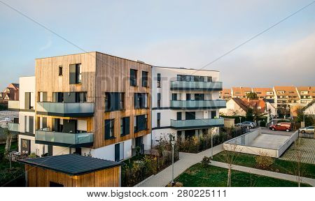 Modern Townhouses In A Residential Area With Multiple New Apartments Buildings Surrounded By Green O