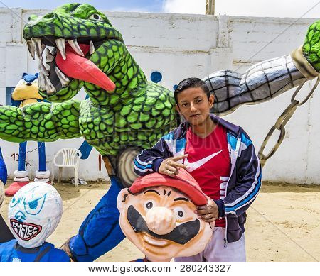 Salinas, Ecuador - December 31, 2015 - Boy Poses With Paper Mache Mario He Created And Is Selling Fo