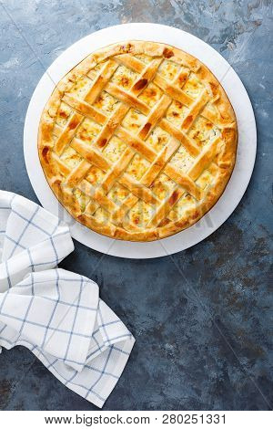 Pie With Salted Soft Cheese And Greens, Top View