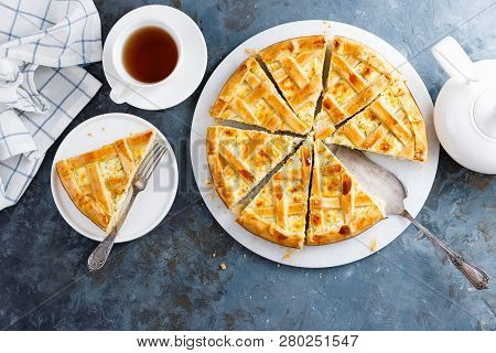 Pie With Salted Soft Cheese And Greens, Top View