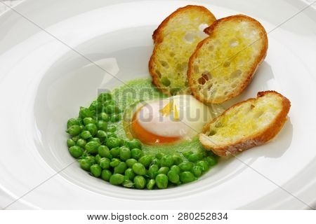 tear peas with poached egg, spanish basque cuisine