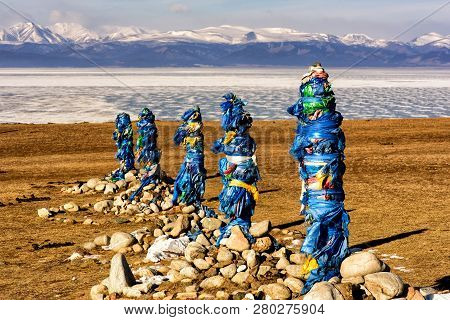 Sacred Place With Obo. Winter Landscape Of Mongolia. Lake Khubsugul And Mountain