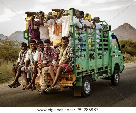 Kochi, India, Mar 4, 2018, Men Ride In Truck - Men Crowd Into The Back Of A Truck To Be Transported 