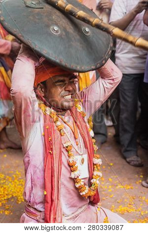Barsana, India - February 24, 2018 - Lathmar Holi Festival - Women Beat Men With Bamboo Sticks Until