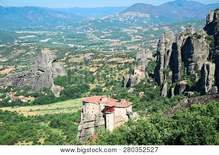 Beautifful View Of Small Rock Monastery Roussanou St. Barbarain And Thessalian Plain. Meteora, Greec