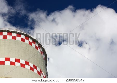 White Smoke Comes From Pipes Against Blue Sky. Problem Harmful Emissions And Air Pollution Of Centra