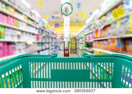Closeup Shopping Basket Green Color With Blurred Suppermarket Background