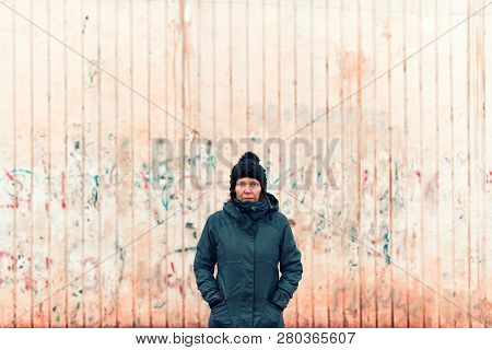 Portrait Of Troubled Uptight Woman On The Street On Cold Winter Day Looking At Camera