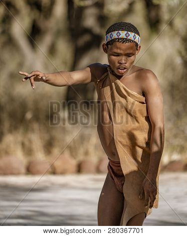 Erindi, Namibia - July 19, 2018: A Native Bushman Gives A Farewell Dance To Wish Good Hunting To The