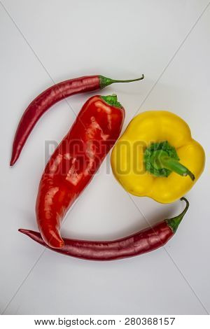 Variety Pepper. Red Peppers And Yellow Pepper. On White Background, Isolate, Background, Copyice
