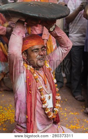 Barsana, India - February 24, 2018 - Lathmar Holi Festival - Women Beat Men With Bamboo Sticks Until