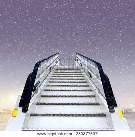 frontal view of white ramp in airport at winter