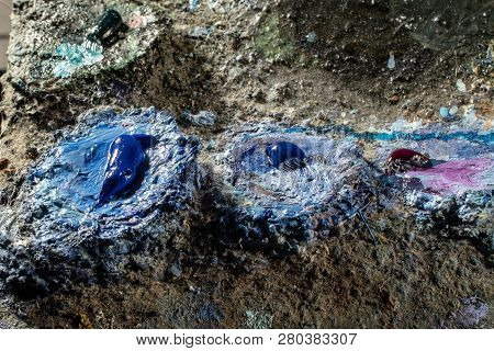 Oil Art Paints On A Very Old Palette. Close-up