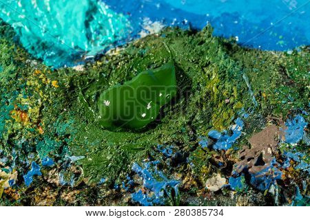 Oil Art Paints On A Very Old Palette. Close-up
