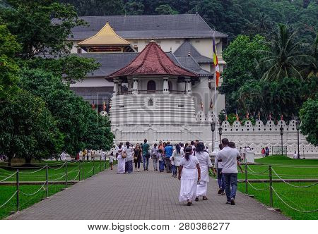 Kandy, Sri Lanka - Dec 15, 2018. White Clothed Buddhist Devotees Visit Temple Of The Sacred Tooth Re