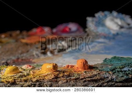 Oil Art Paints On A Very Old Palette. Close-up