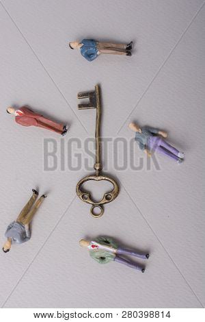 Tiny Figurine Of Man Miniature And Retro Key