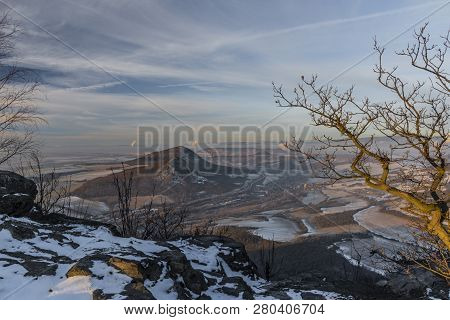 Sunrise On Boren Hill Near Bilina Town In Winter Frosty Color Morning
