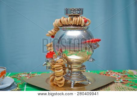 Traditional Russian Old Samovar For Tea Drinking With Tasty Bagels . Cock Is Samovar . Metallic Russ