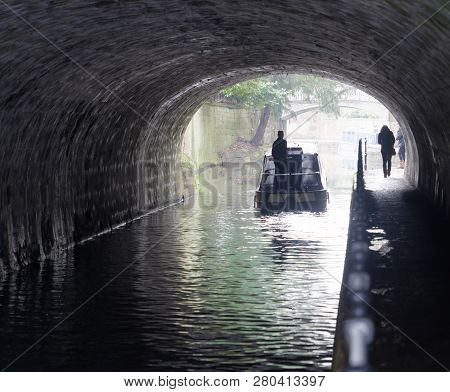 Bath, Great Britain - Dec 25, 2018: Narrow Boat In A Tunnel In The Kennet And Avon Canal  In The Cit