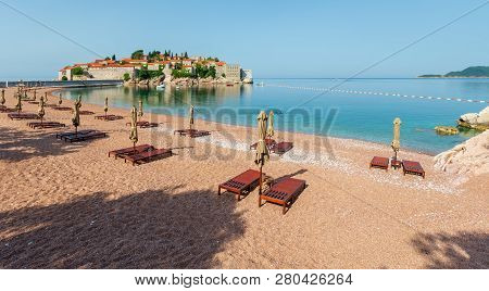 Pink Sandy Milocher Beach And Sveti Stefan Islet Morning View (montenegro, Near Budva). People Unrec