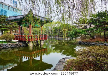 SEOUL, SOUTH KOREA - APRIL 8, 2017: Yeouido Park public park pond with pavilion summerhouse in Seoul, Korea