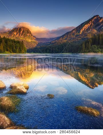 Fantastic views of the turquoise Lake Obersee under sunlight. Dramatic and picturesque scene. Location famous resort: NÃ¤fels, Mt. BrÃ¼nnelistock, Swiss Alps. Europe. Artistic picture. Beauty world.