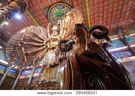 Kanchanaburi.thailand,jan 24,2019 ,take Photo  Gilr  Image And Large Guan Yin Bodhisattva Carved Fro