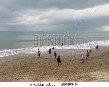 Anyer, Indonesia - June 26, 2018: Some Boys Play Football On The Sand Beach Of Sambolo Anyer.