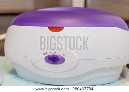 Preparation For Sugaring. Heat Up. Stick. Cosmetology Center Concept.hot Wax In White Bowl For Hair 