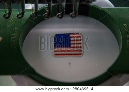 Close-up Of Embroidery Malaysia Logo With Wording Negaraku (my Country) On White Uniform