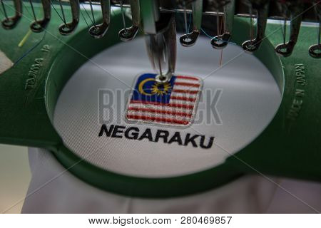 Close-up Of Embroidery Malaysia Logo With Wording Negaraku (my Country) On White Uniform