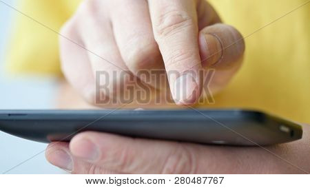 Close-up Of Hands Holding Smartphone, Typing Text On Touch Screen And Using Applications. A Person T