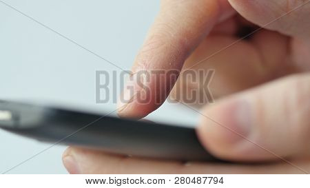 Close-up Of Hands Holding Smartphone, Typing Text On Touch Screen And Using Applications. A Person T