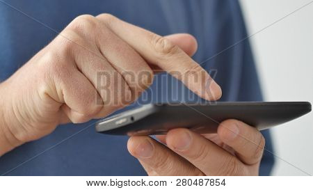 Close-up Of Hands Holding Smartphone, Typing Text On Touch Screen And Using Applications. A Person T