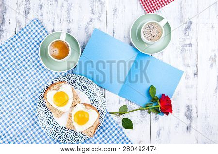 Flowers, Two Cups Of Aromatic Coffee And Heart-shaped Toasts For A Romantic Morning Of Lovers. Red R