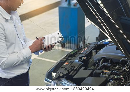 This Career Man Saleman Business Inspection Writing Note On Notepad Or Book, Paper With Car Blurry B