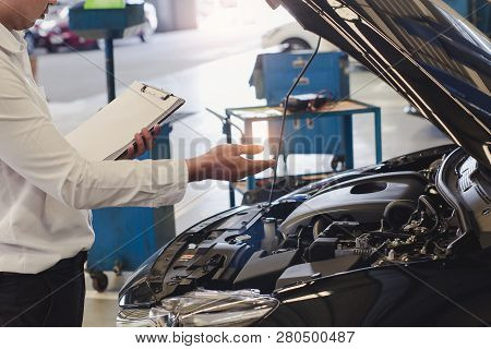 This Career Man Saleman Business Inspection Writing Note On Notepad Or Book, Paper With Car Blurry B