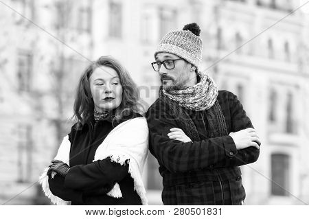 Couple With Crossed Hand On Chest And Lean To Shoulders Looked At Each Other. Urban Couple Disagree.