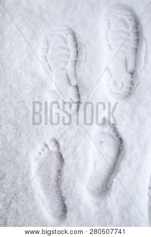 Hardy Person Strengthens His Health, Leaving Traces Of His Bare Feet In The Snow In Winter In Cold W